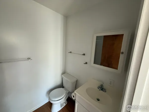 a white toilet sitting next to a bathroom sink