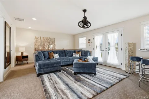 a living room with furniture and a rug