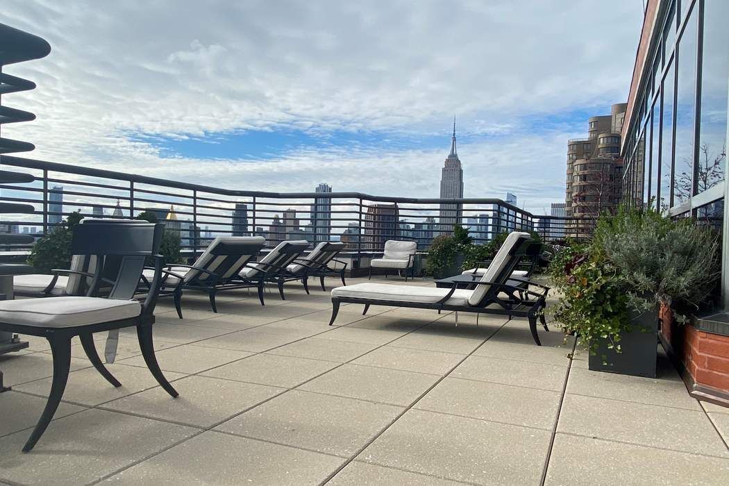 415 East 37th Street, Unit 21J Manhattan, NY 10016 - Photo 10 of 14 a view of a terrace with furniture