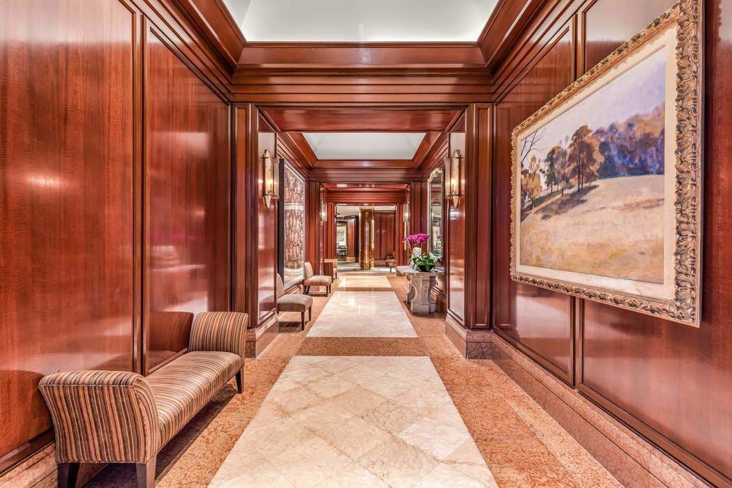 415 East 37th Street, Unit 21J Manhattan, NY 10016 - Photo 13 of 14 a lobby with furniture and window