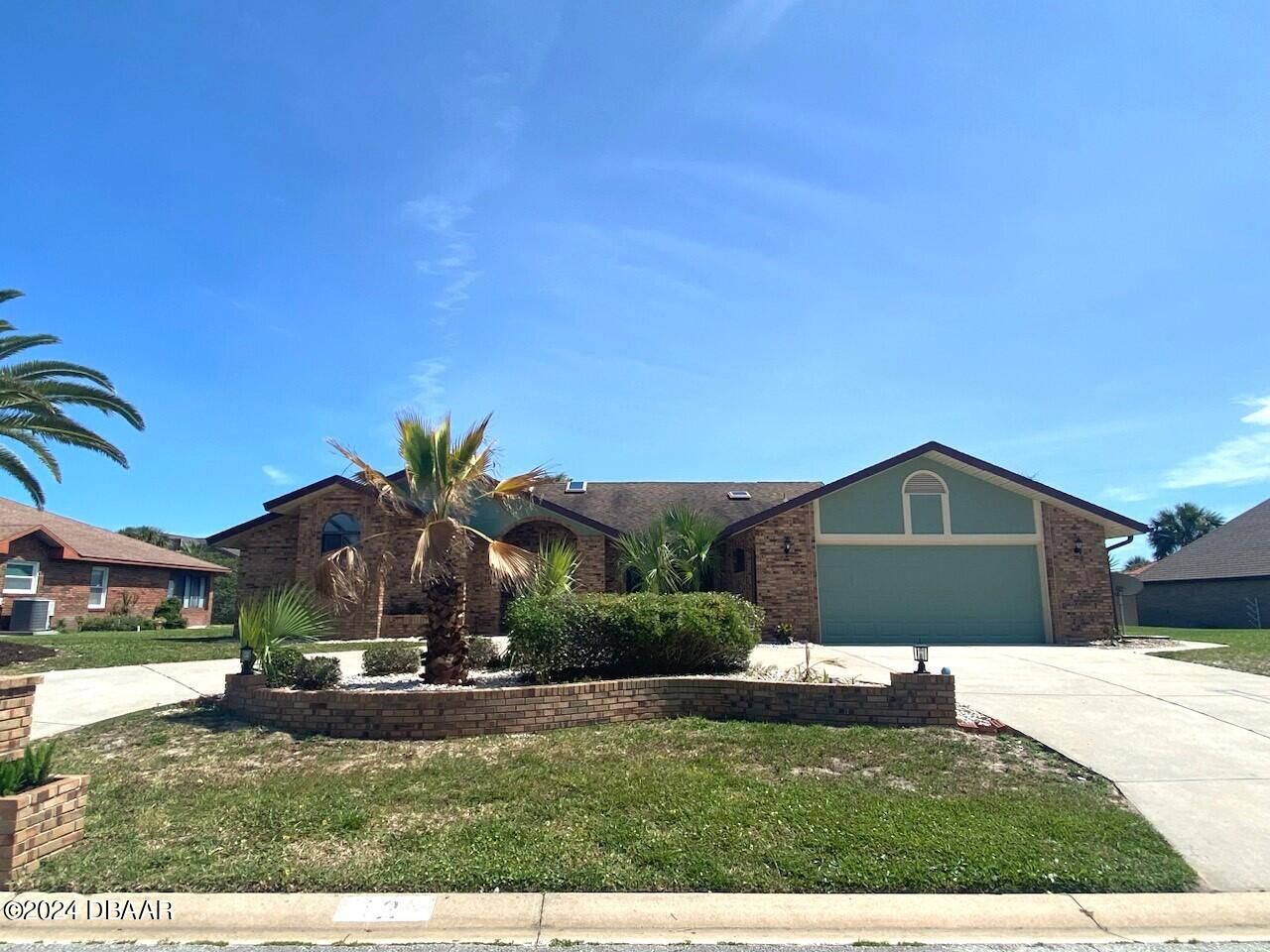 12 Julie Drive Ormond Beach, FL 32176 - Photo 1 of 24 a front view of a house with a yard