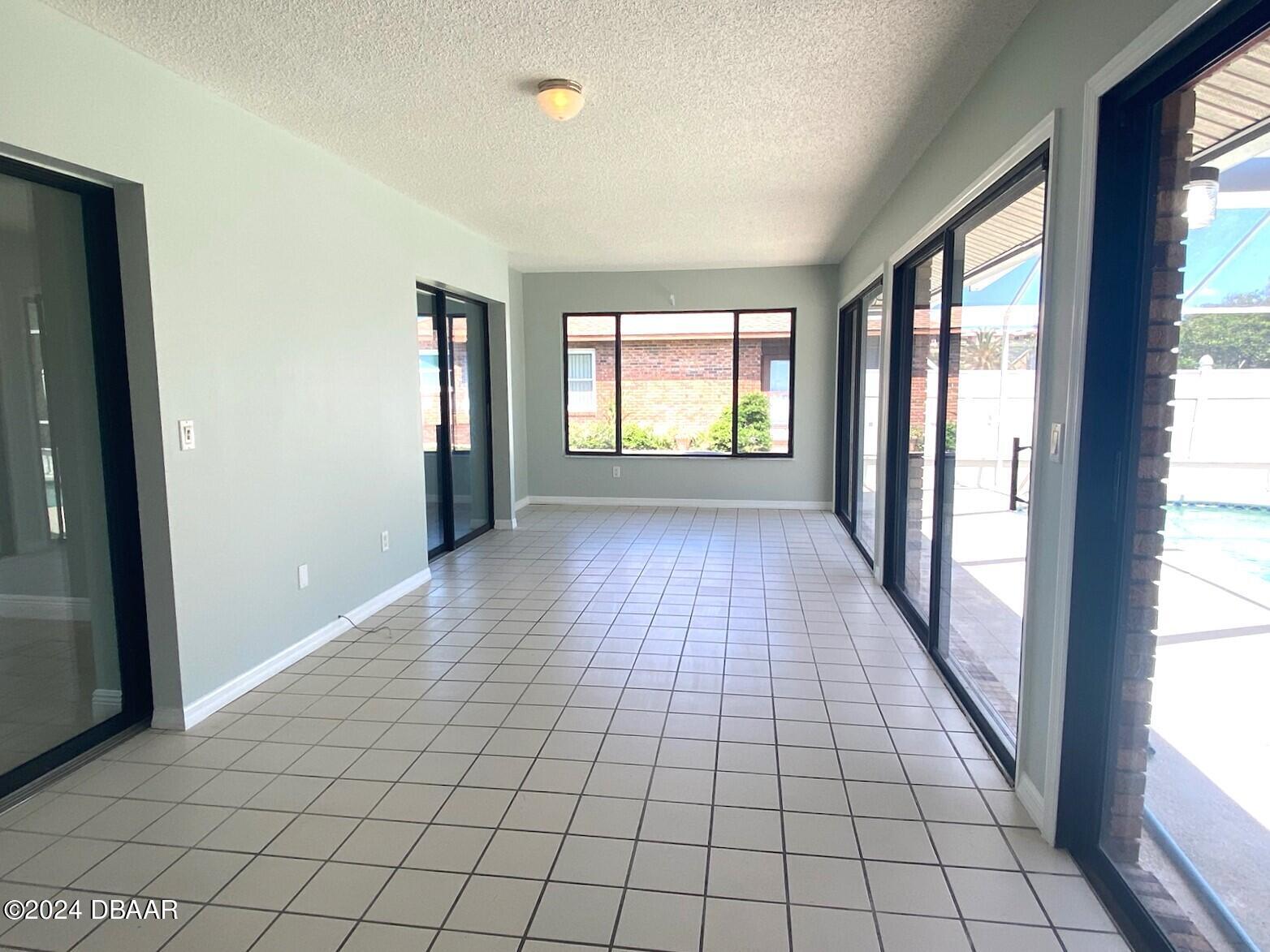 12 Julie Drive Ormond Beach, FL 32176 - Photo 20 of 24 a view of an empty room and window