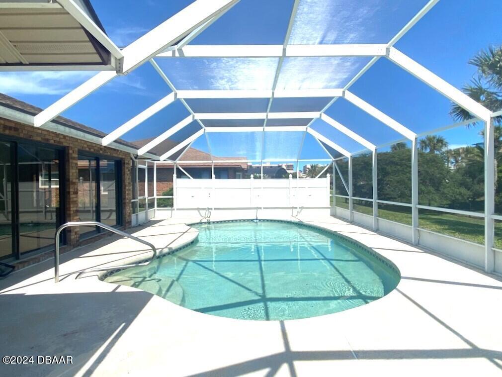 12 Julie Drive Ormond Beach, FL 32176 - Photo 22 of 24 a house with swimming pool in front of it