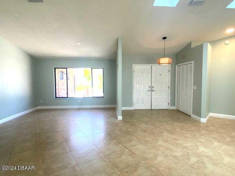 12 Julie Drive Ormond Beach, FL 32176 - Photo 5 of 24 an empty room with windows and closet