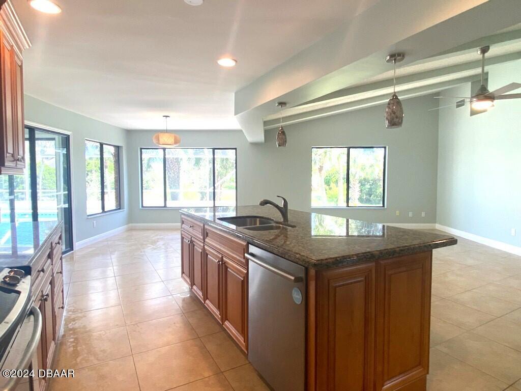 12 Julie Drive Ormond Beach, FL 32176 - Photo 6 of 24 a kitchen with stainless steel appliances granite countertop a sink and a stove