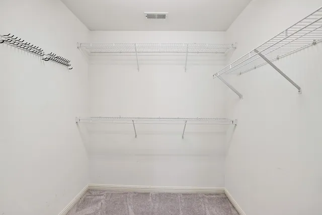 a view of a room with racks on the wall