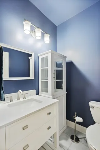 a kitchen with stainless steel appliances granite countertop a refrigerator sink and stove