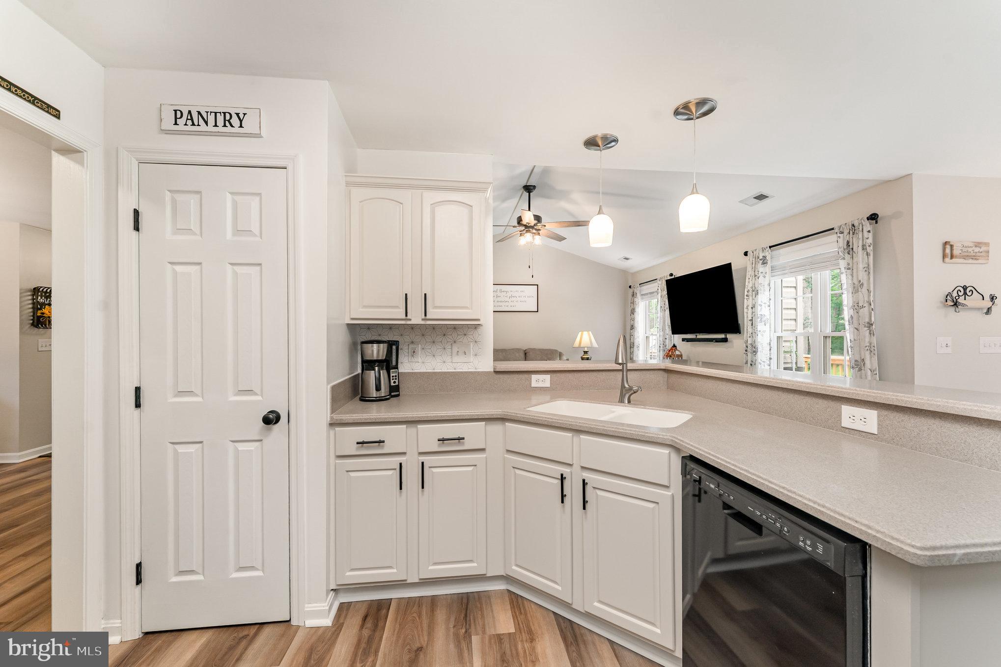 102 Parliament Street Locust Grove, VA 22508 - Photo 11 of 29 a kitchen with white cabinets and sink
