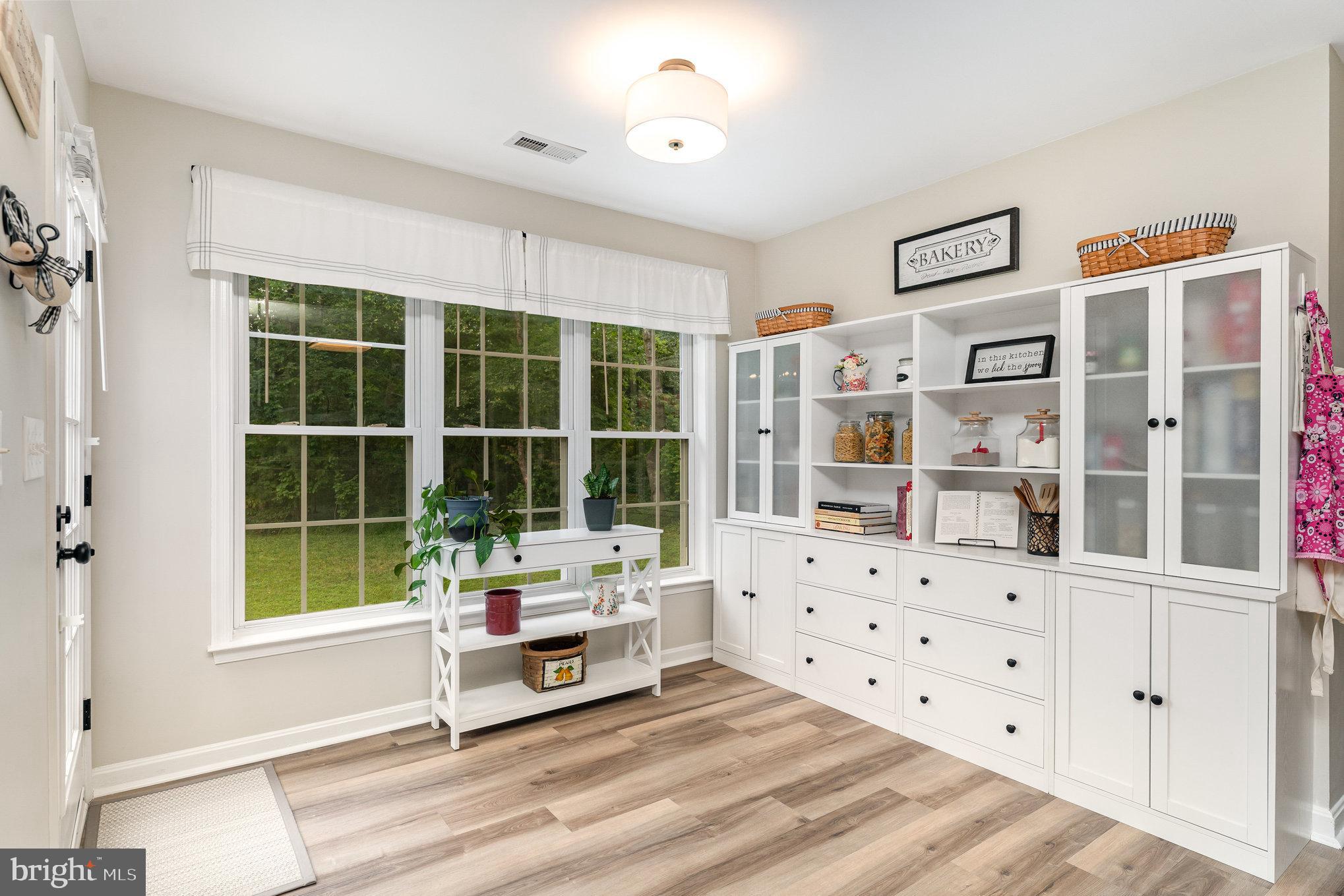 102 Parliament Street Locust Grove, VA 22508 - Photo 14 of 29 a living room with furniture cabinets and window