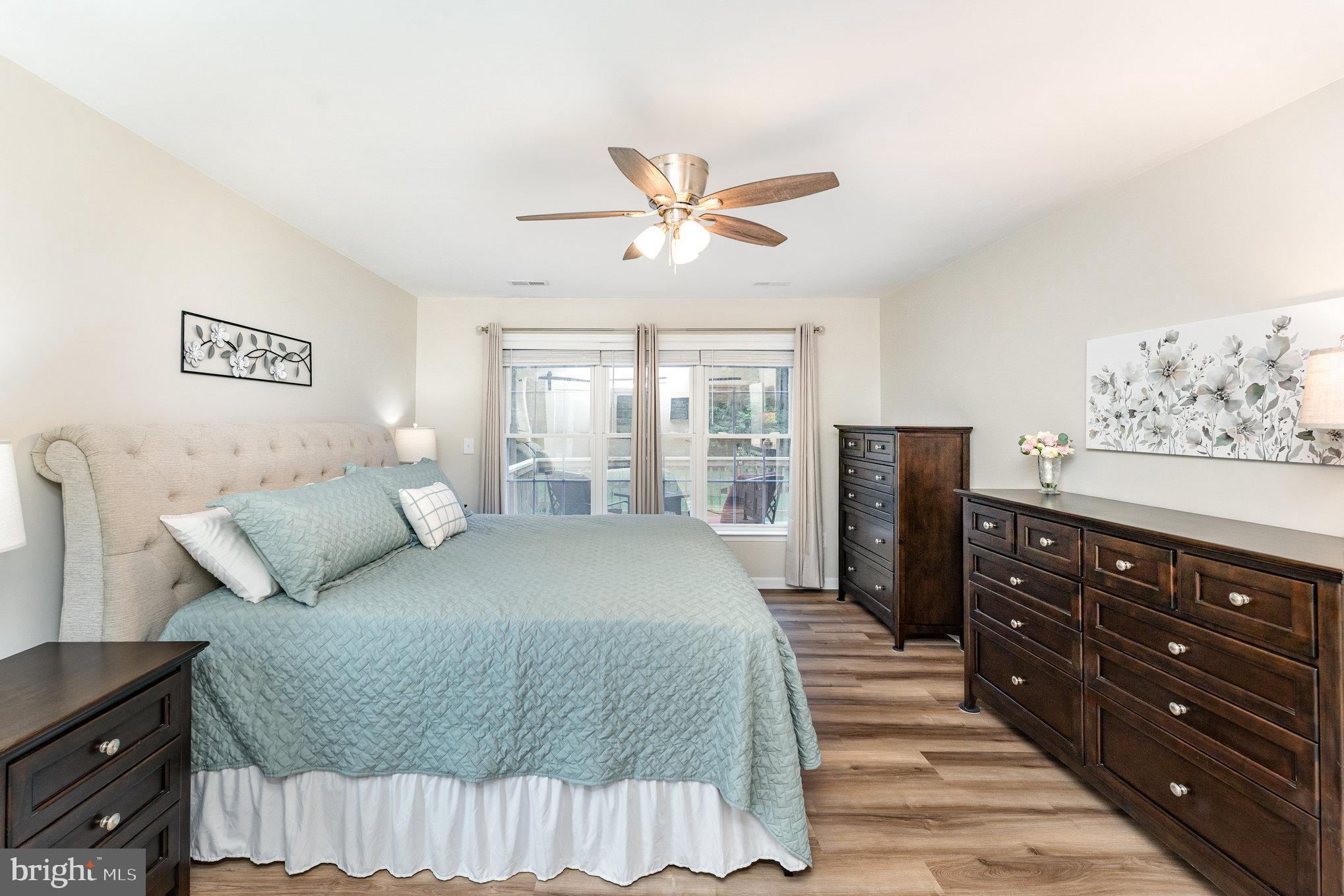 102 Parliament Street Locust Grove, VA 22508 - Photo 15 of 29 a bedroom with a bed and wooden floor