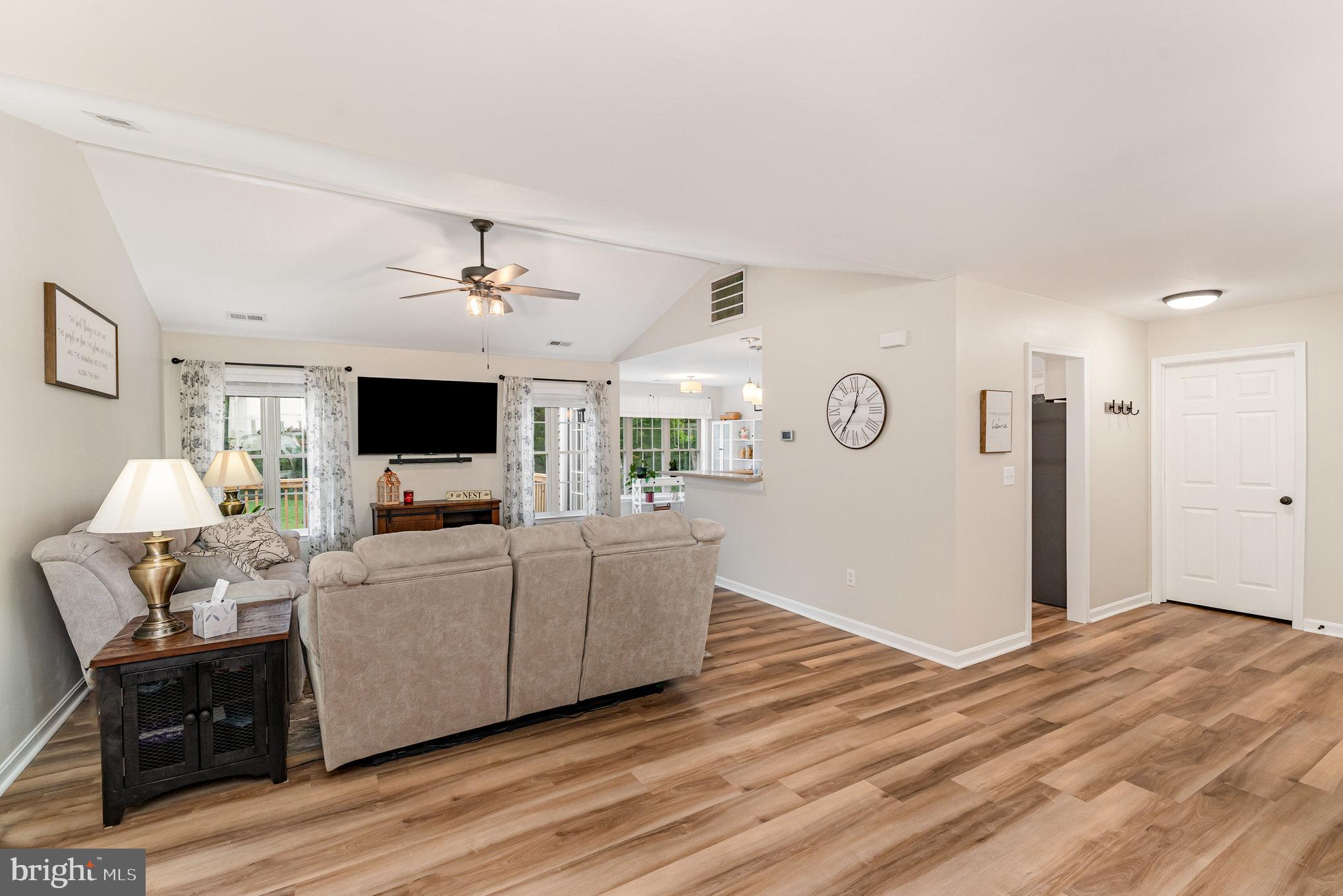 102 Parliament Street Locust Grove, VA 22508 - Photo 4 of 29 a living room with furniture and a flat screen tv