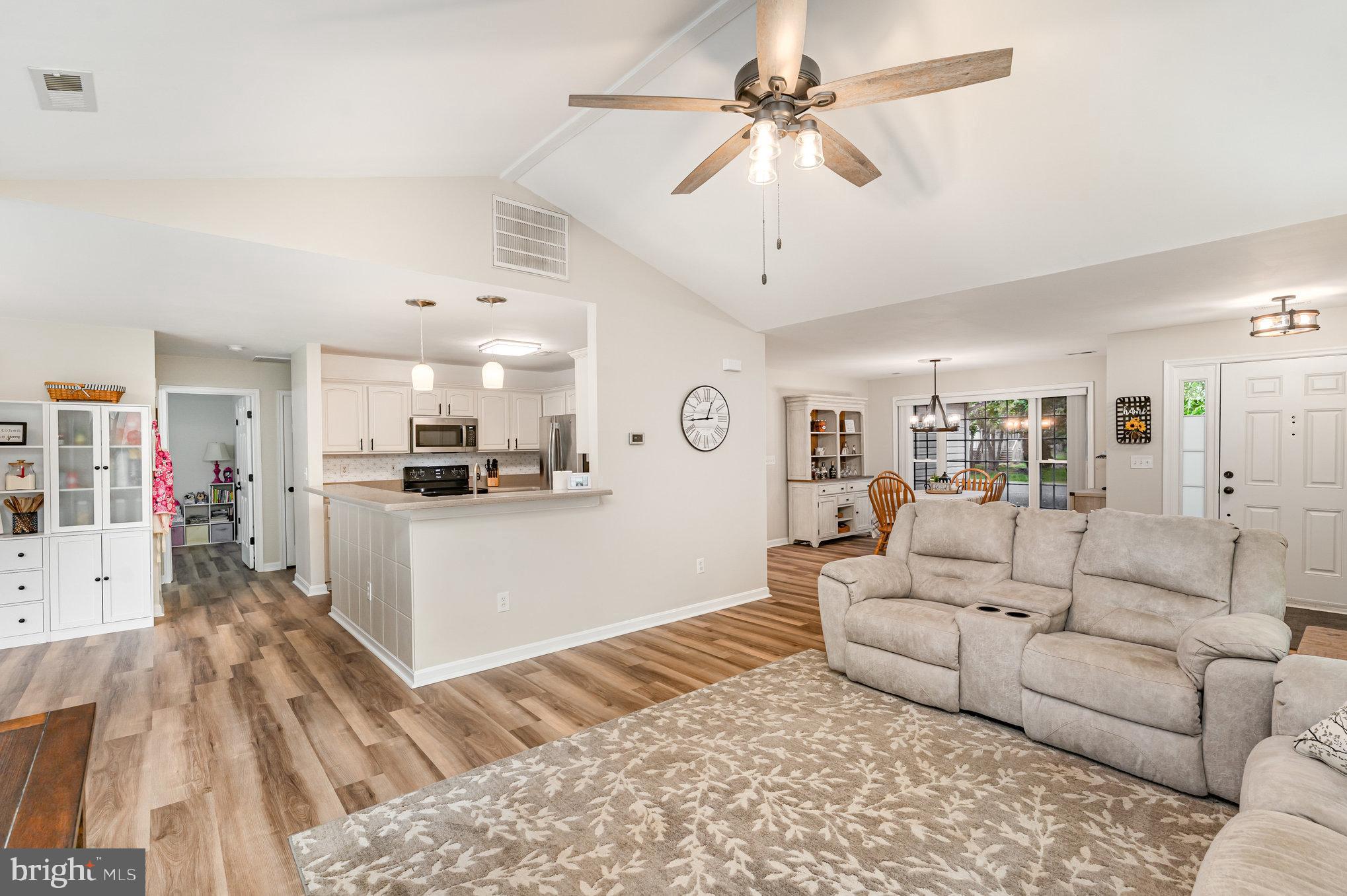 102 Parliament Street Locust Grove, VA 22508 - Photo 5 of 29 a living room with furniture and a kitchen view