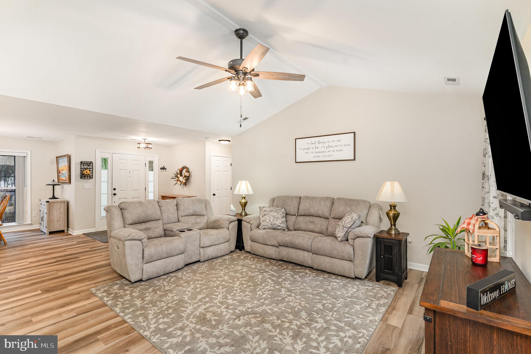102 Parliament Street Locust Grove, VA 22508 - Photo 6 of 29 a living room with furniture and a flat screen tv