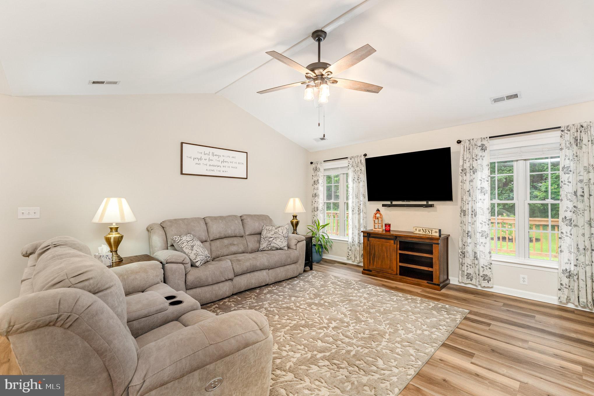 102 Parliament Street Locust Grove, VA 22508 - Photo 7 of 29 a living room with furniture and a flat screen tv