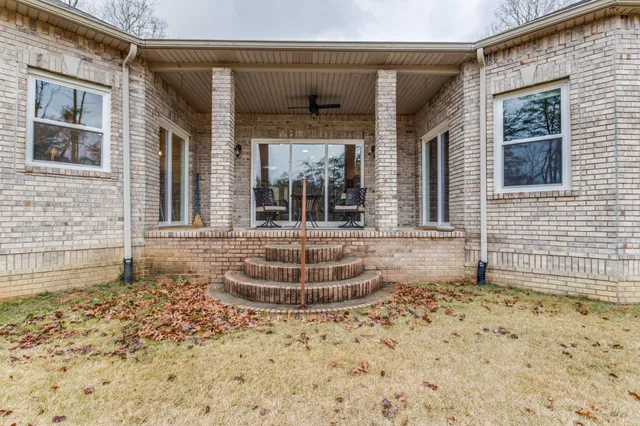 a view of a swimming pool with a yard