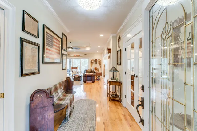 a view of a living room kitchen and a wooden floor