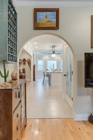 a kitchen with cabinets a sink dining table and chairs
