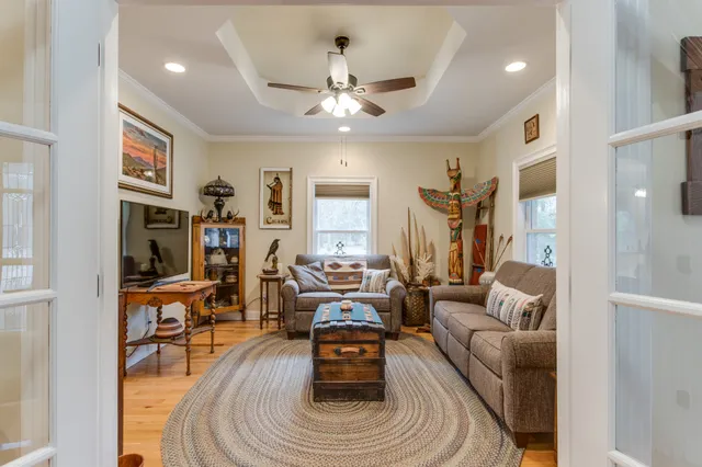 a kitchen with granite countertop a sink stove and cabinets