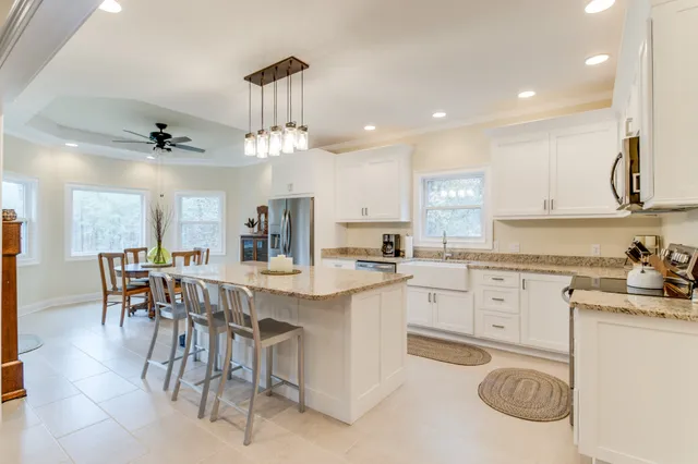 a dining room with furniture and window