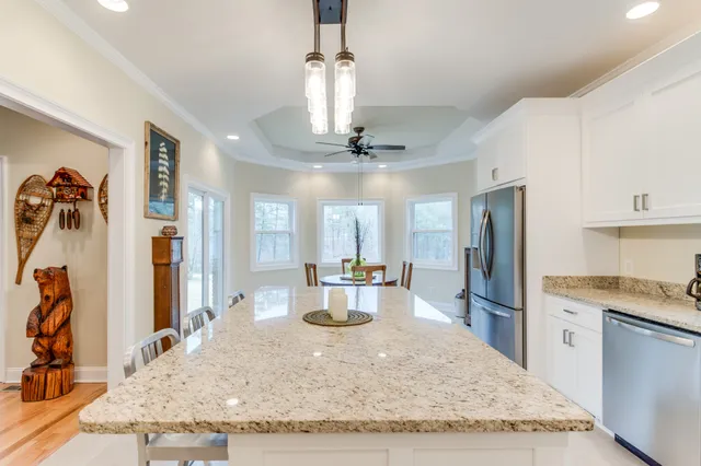 a view of a dining room with furniture window and outside view