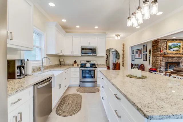 a view of a room that has a bed in it