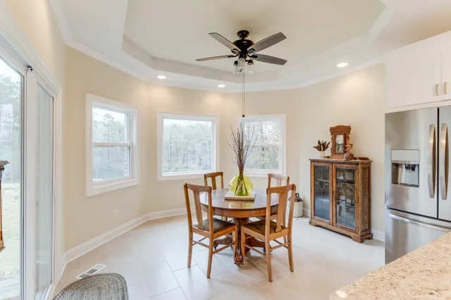 view of a bathroom with a shower a sink and a mirror