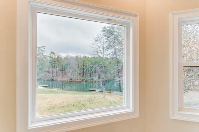 a bathroom with a sink a mirror and shower view