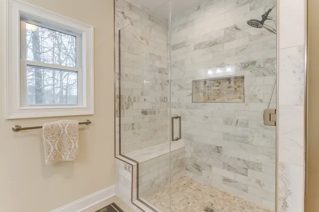 a view of a yard with trees in the background