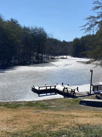 an aerial view of residential house with outdoor space and pool
