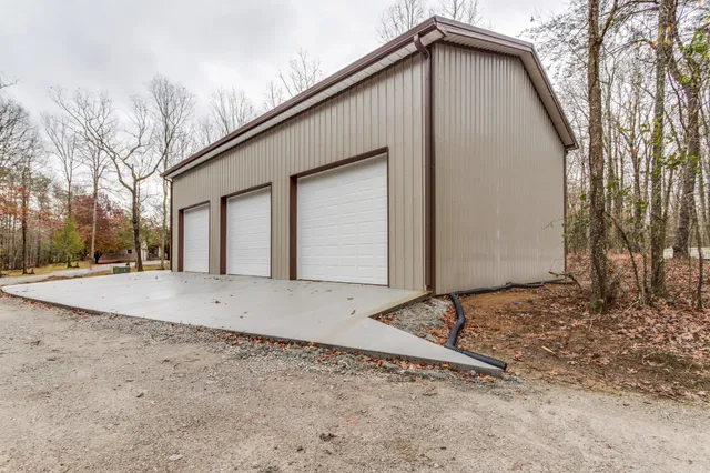 a view of a yard with large trees