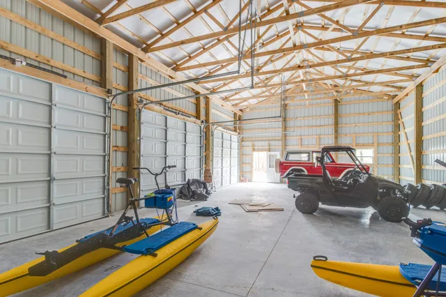 a view of a yard with large trees