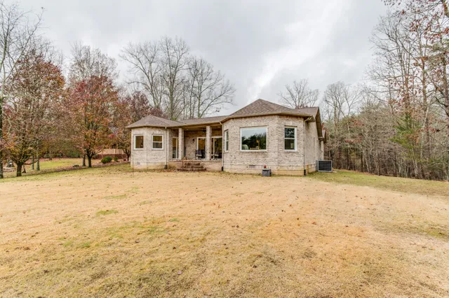 a view of a house with a snow in the yard