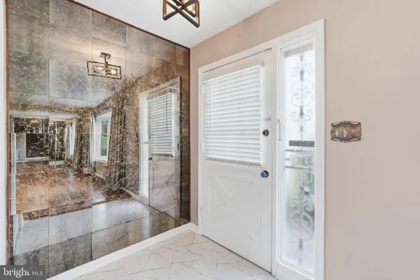 a bathroom with a tub shower and sink