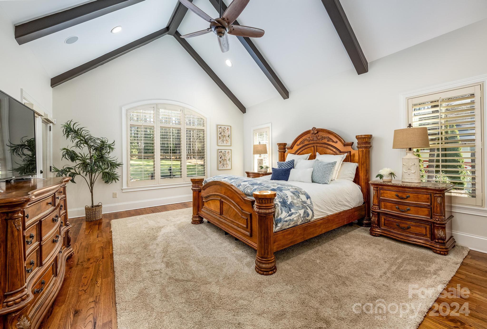 320 Barber Loop Mooresville, NC 28117 - Photo 16 of 44 a bedroom with a bed and a large window