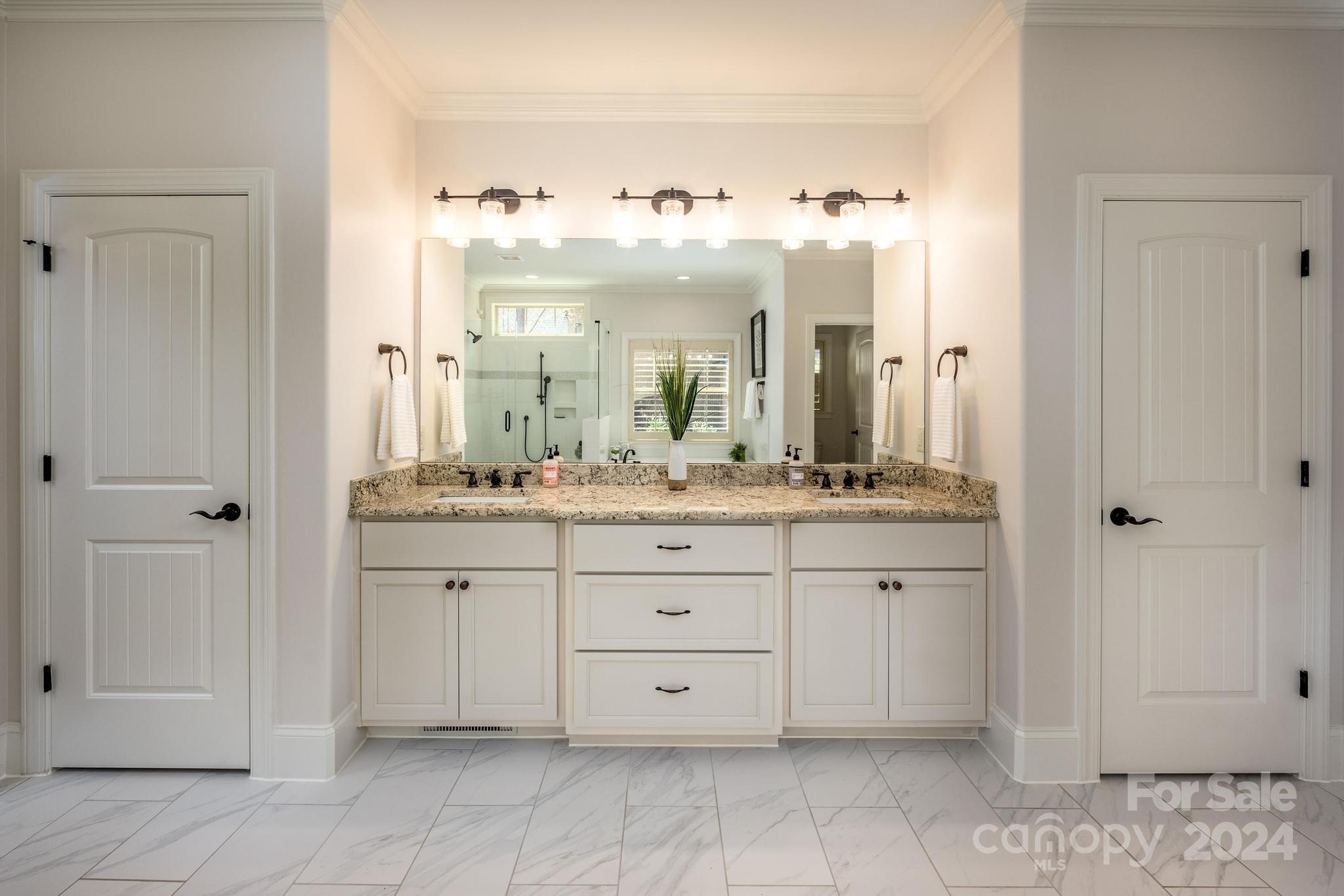320 Barber Loop Mooresville, NC 28117 - Photo 17 of 44 a bathroom with a sink vanity and a mirror