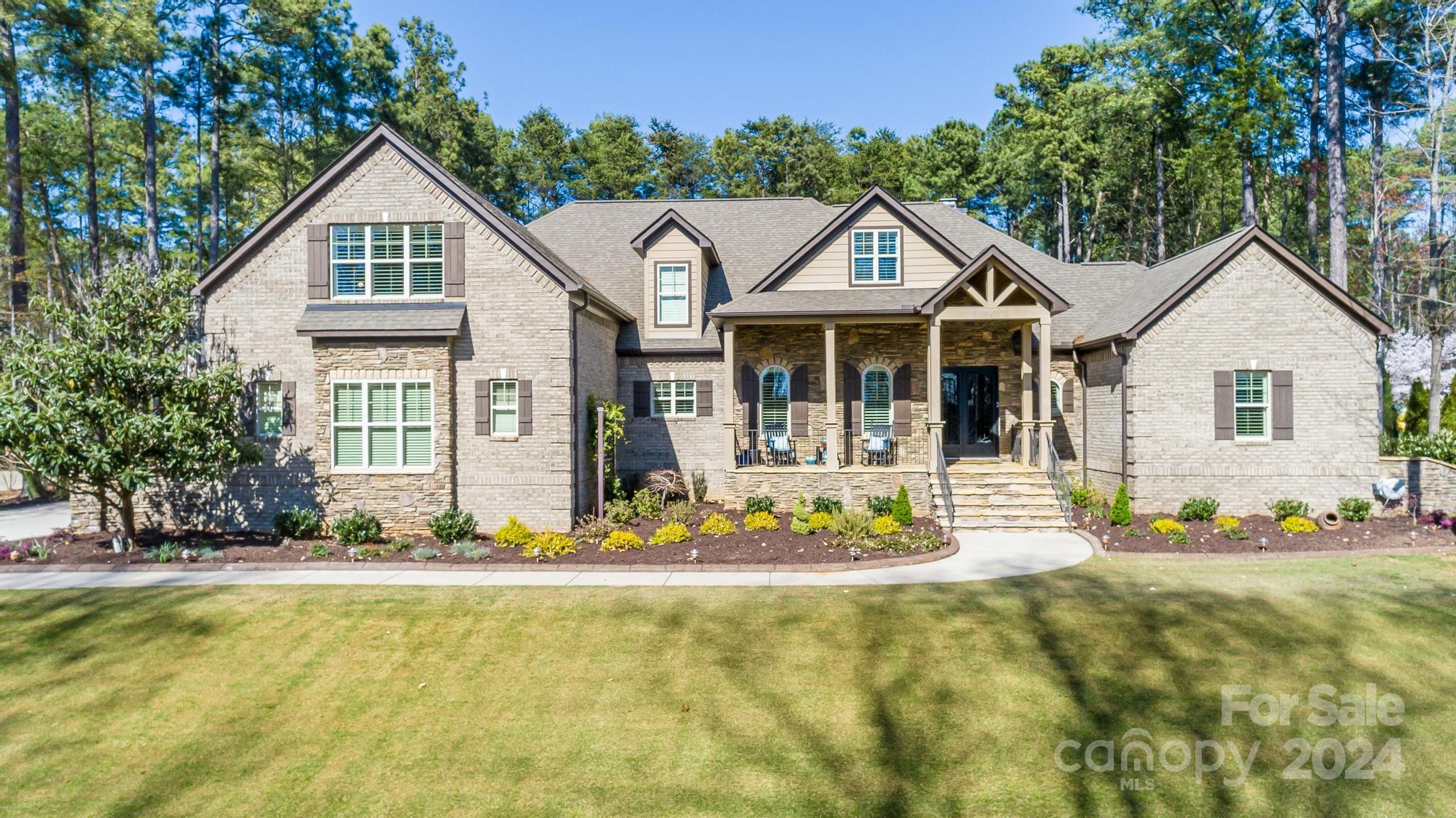 320 Barber Loop Mooresville, NC 28117 - Photo 2 of 44 a front view of a house with a yard