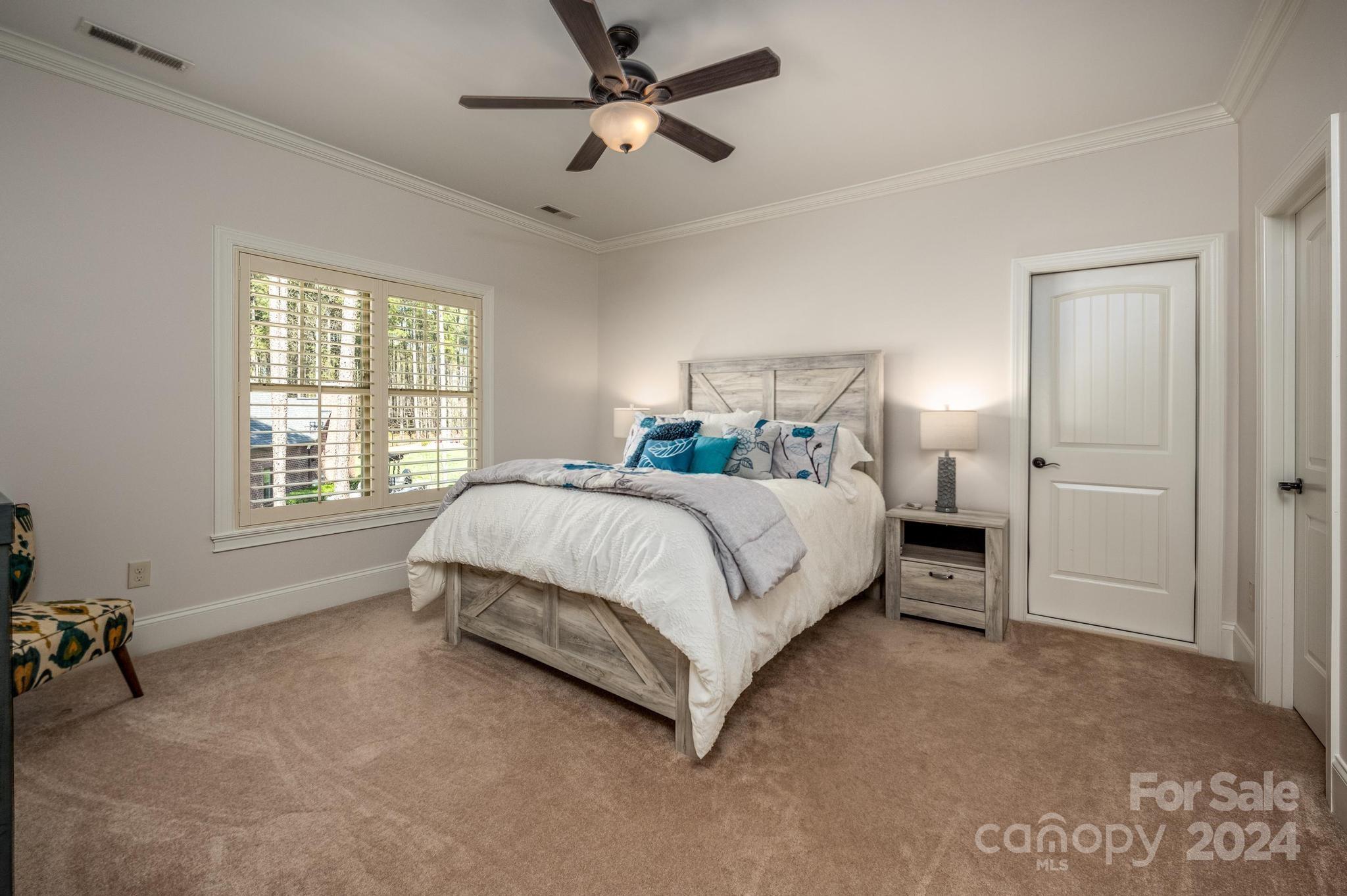 320 Barber Loop Mooresville, NC 28117 - Photo 30 of 44 a bed sitting in a spacious bedroom next to a window