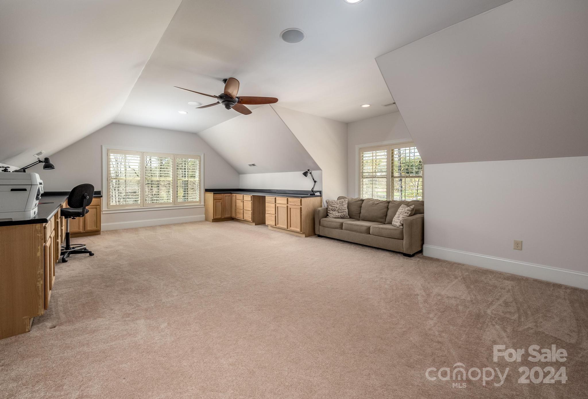 320 Barber Loop Mooresville, NC 28117 - Photo 32 of 44 a living room with furniture and a chandelier