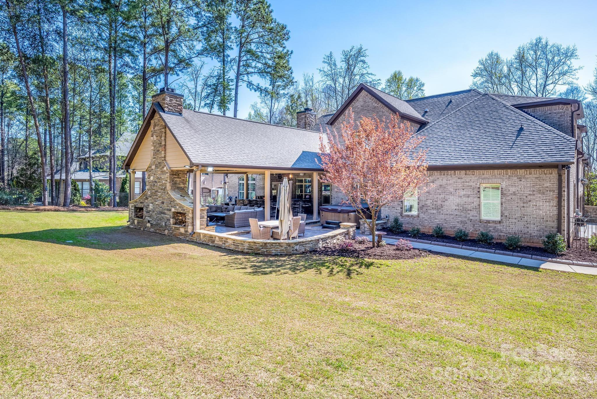 320 Barber Loop Mooresville, NC 28117 - Photo 40 of 44 a view of house with yard outdoor seating and swimming pool