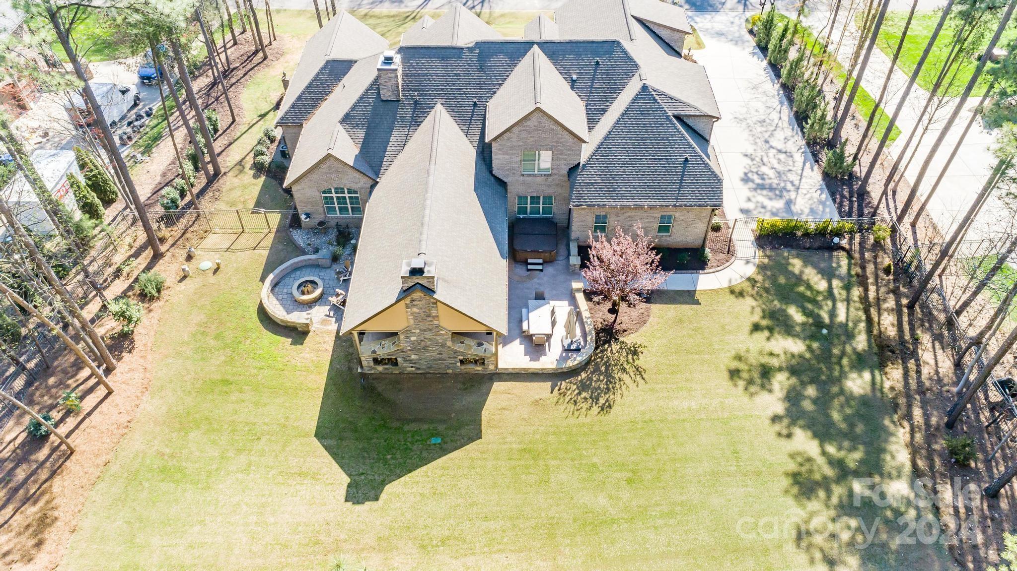 320 Barber Loop Mooresville, NC 28117 - Photo 4 of 44 a view of roof house with large trees