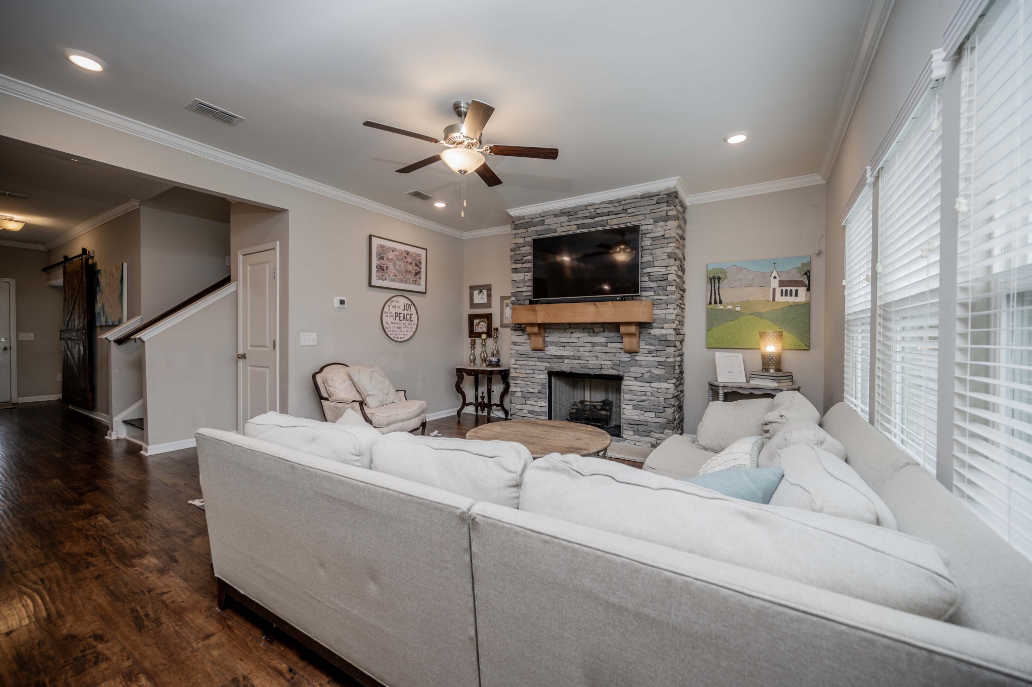 416 Butler Road Mount Juliet, TN 37122 - Photo 11 of 46 a living room with furniture a fireplace and a flat screen tv