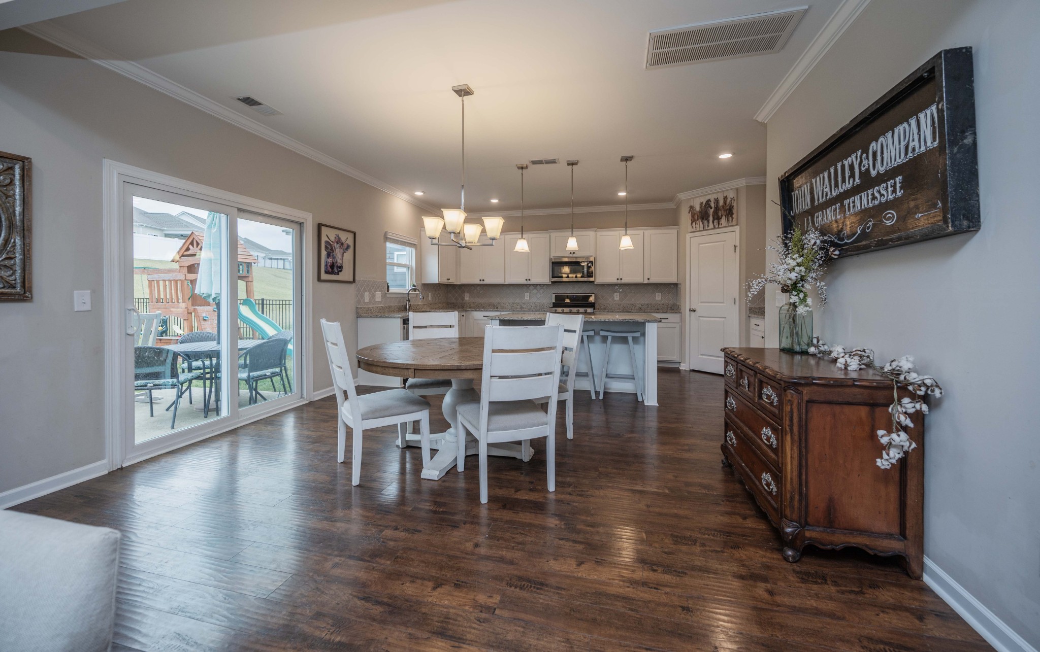 416 Butler Road Mount Juliet, TN 37122 - Photo 14 of 46 a dining area with furniture a chandelier and wooden floor