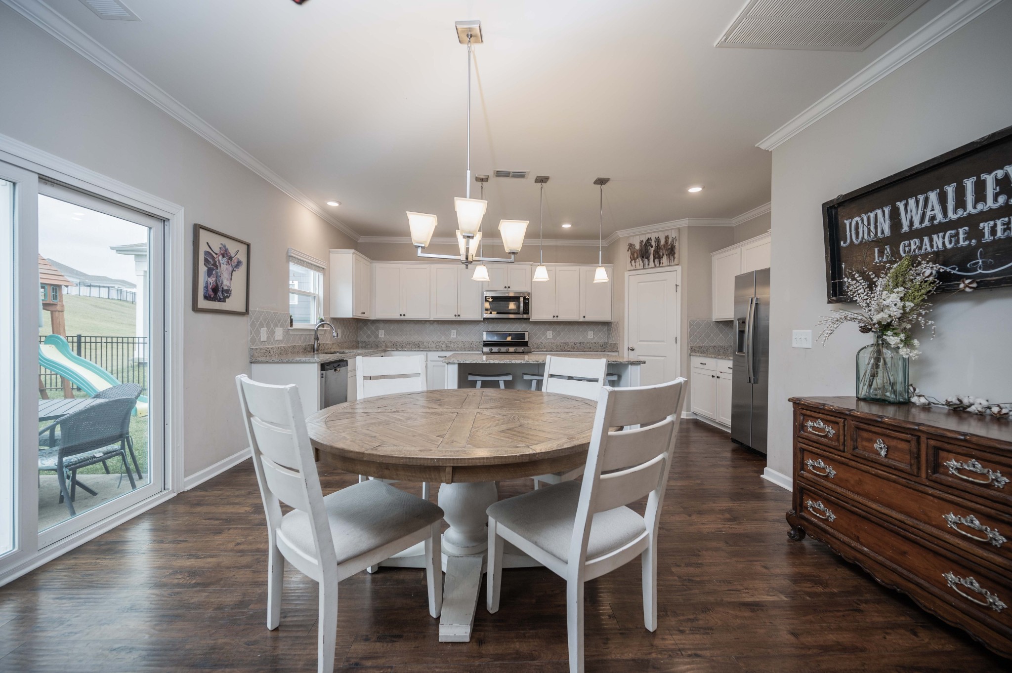 416 Butler Road Mount Juliet, TN 37122 - Photo 15 of 46 a dining room with stainless steel appliances kitchen island a table and chairs