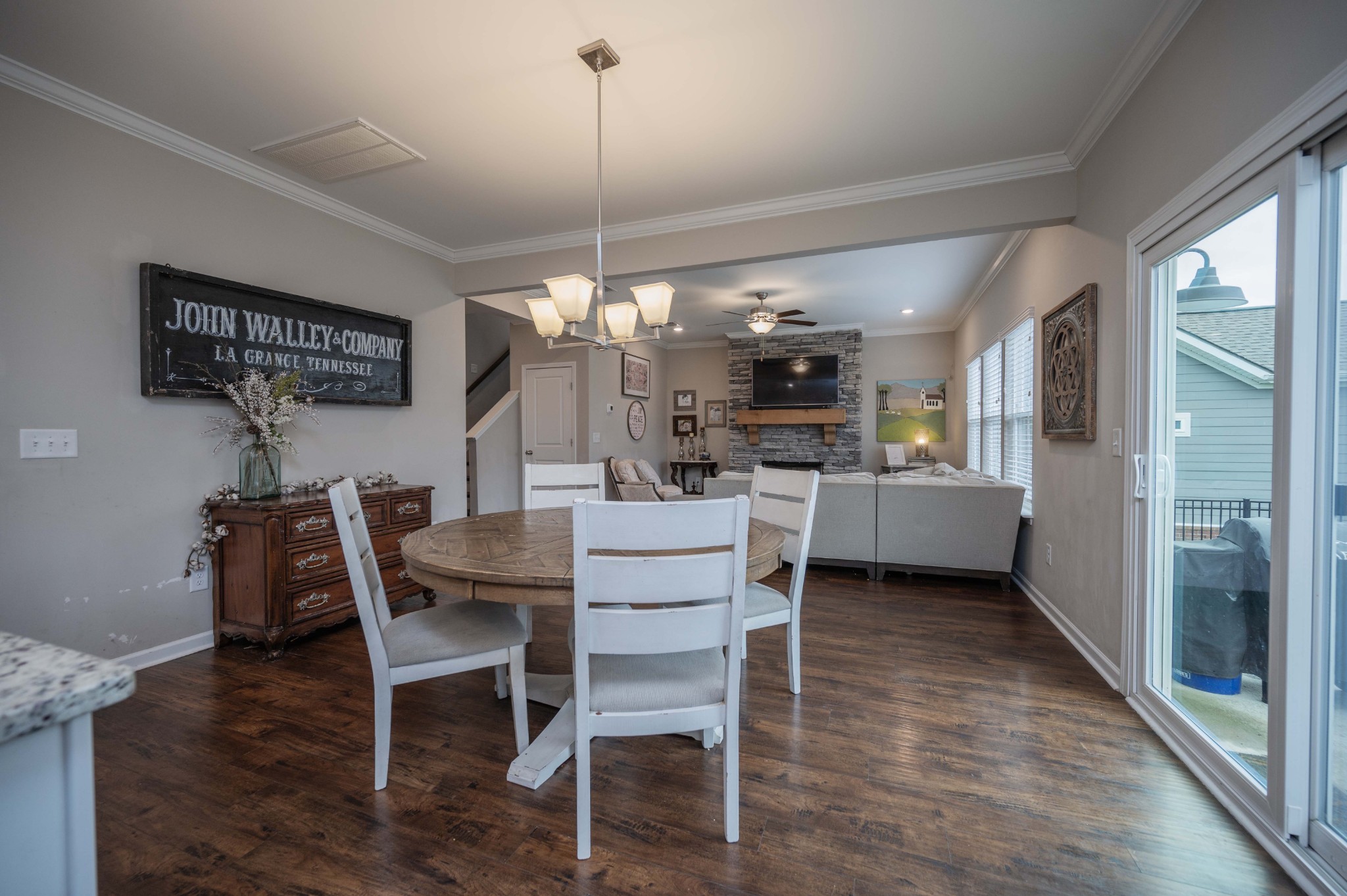 416 Butler Road Mount Juliet, TN 37122 - Photo 17 of 46 a view of a dining room and livingroom with furniture wooden floor a chandelier