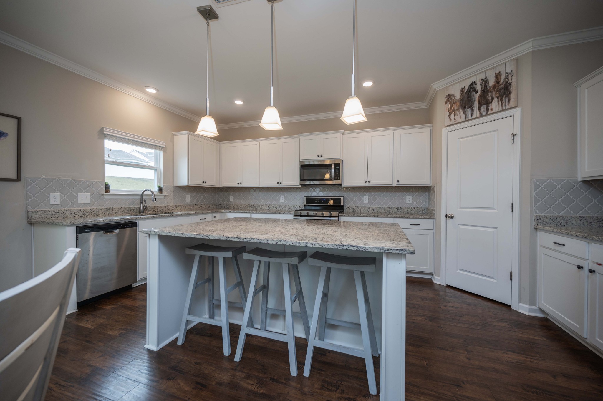 416 Butler Road Mount Juliet, TN 37122 - Photo 18 of 46 a kitchen with kitchen island granite countertop a sink a center island and appliances