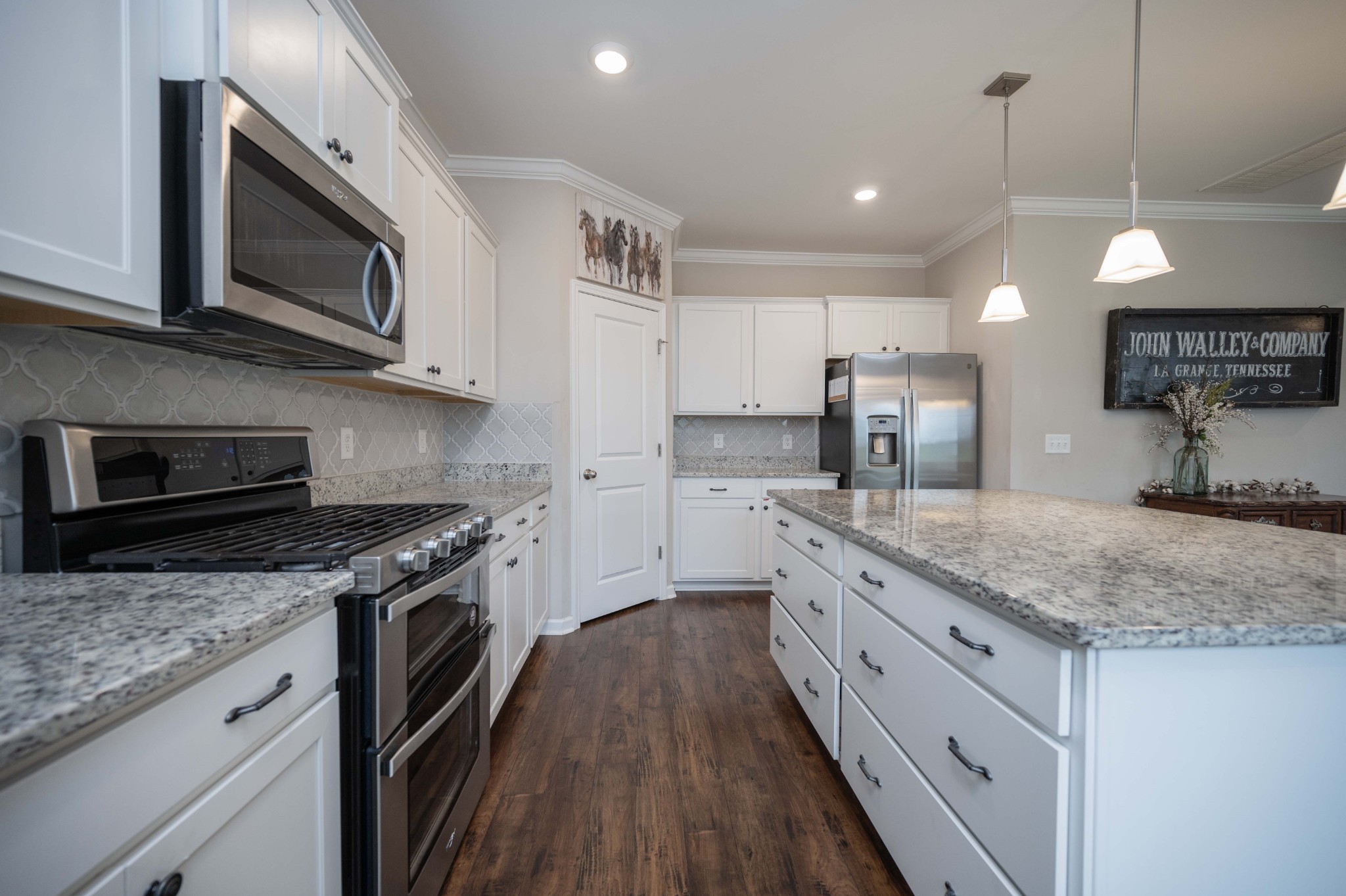 416 Butler Road Mount Juliet, TN 37122 - Photo 20 of 46 a kitchen with stainless steel appliances granite countertop a stove a sink and a microwave
