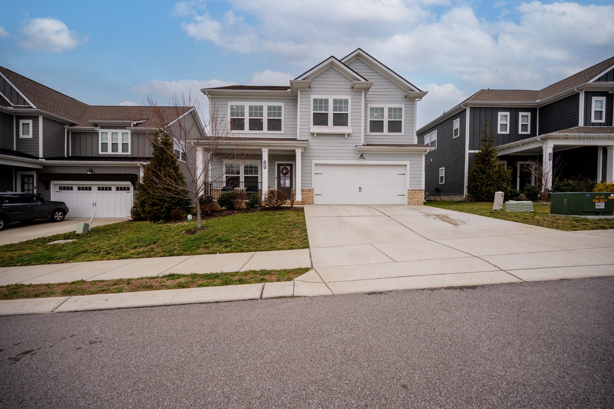 416 Butler Road Mount Juliet, TN 37122 - Photo 2 of 46 a front view of a house with a yard and garage