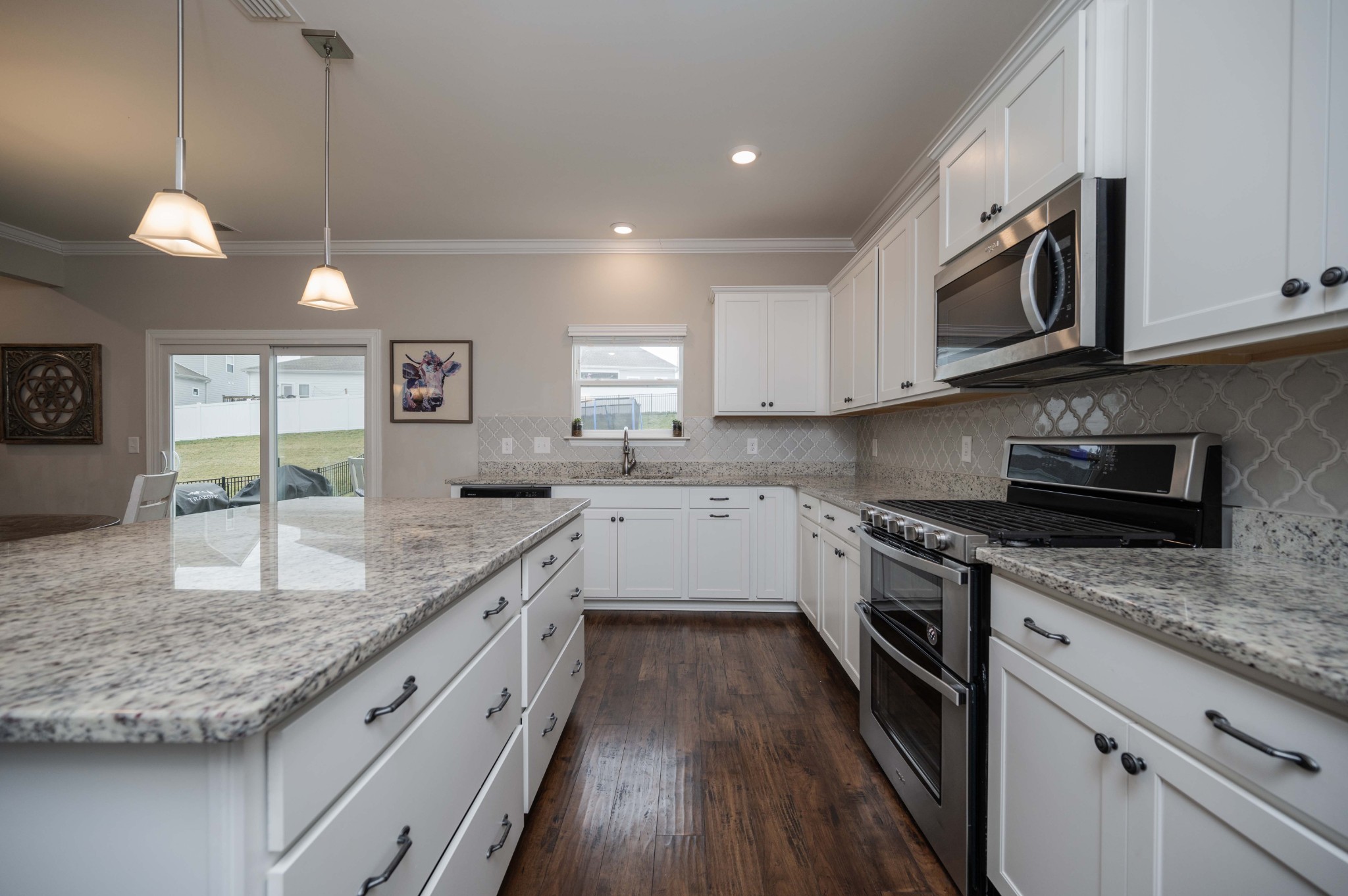 416 Butler Road Mount Juliet, TN 37122 - Photo 21 of 46 a kitchen with stainless steel appliances granite countertop a stove a sink and a microwave