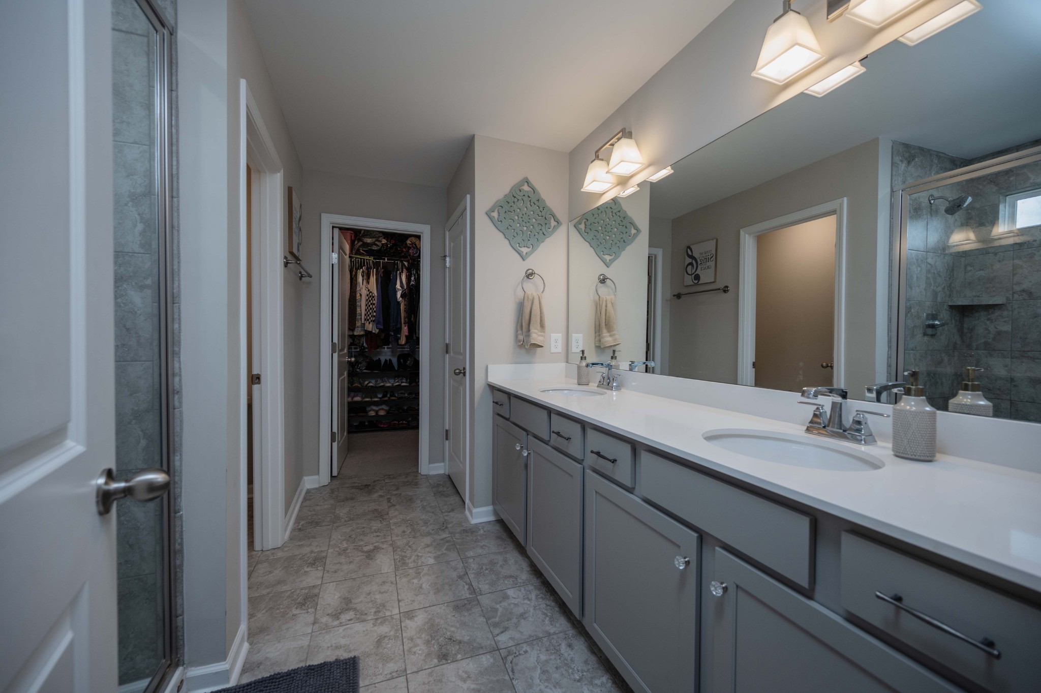 416 Butler Road Mount Juliet, TN 37122 - Photo 28 of 46 a spacious bathroom with a double vanity sink and a mirror