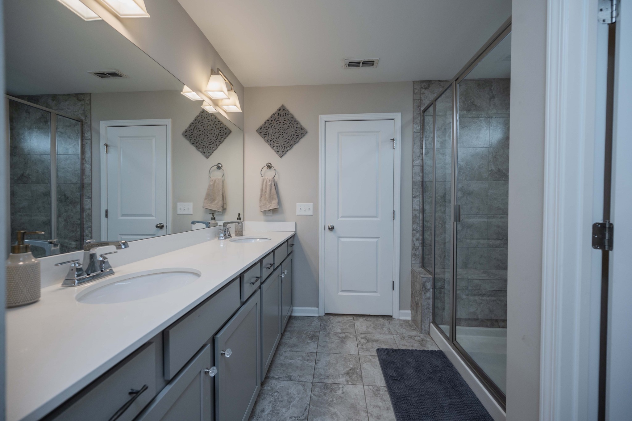 416 Butler Road Mount Juliet, TN 37122 - Photo 29 of 46 a bathroom with a double vanity sink mirror and shower